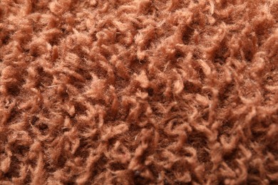 Texture of brown faux fur as background, closeup