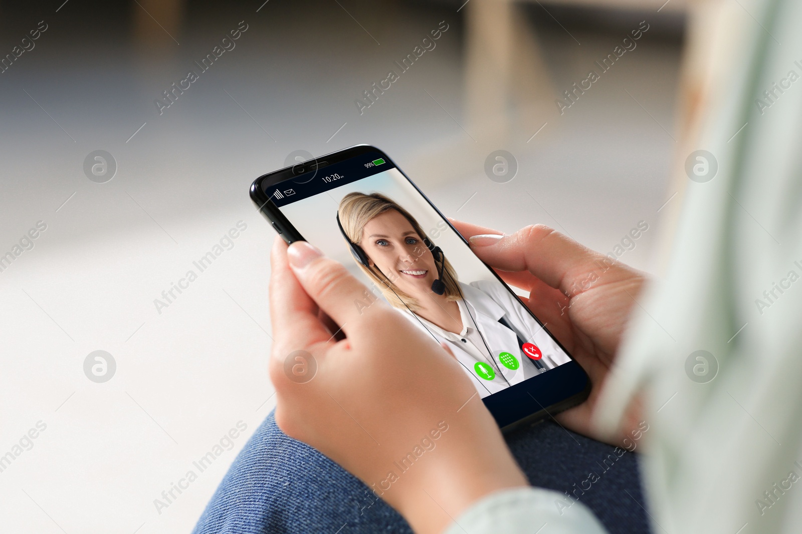 Image of Online medical consultation. Woman having video chat with doctor via smartphone at home, closeup