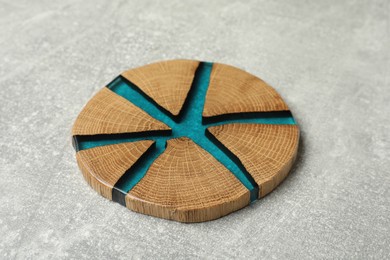 Photo of Stylish wooden cup coaster on light grey table