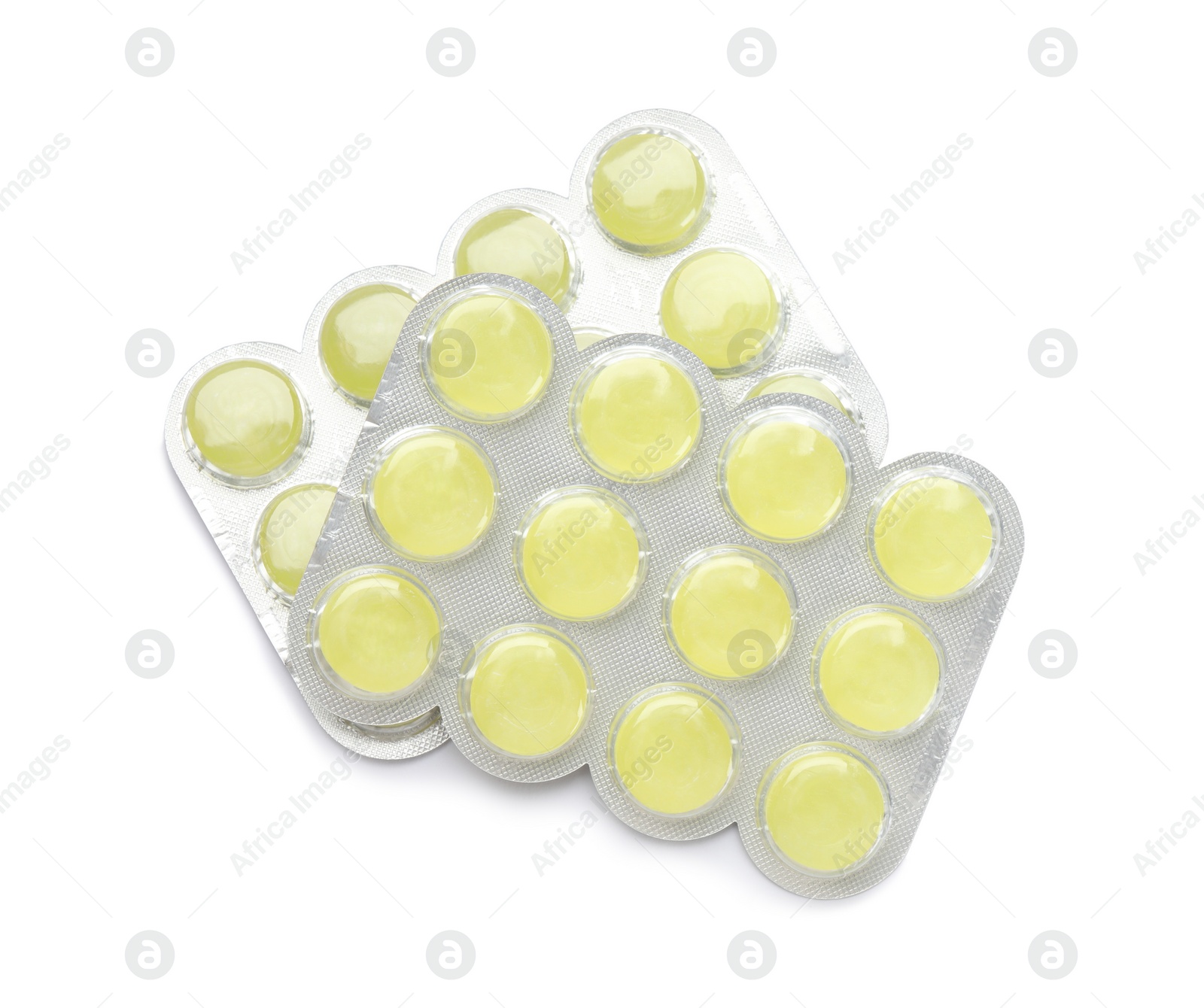 Photo of Blisters with yellow cough drops on white background, top view