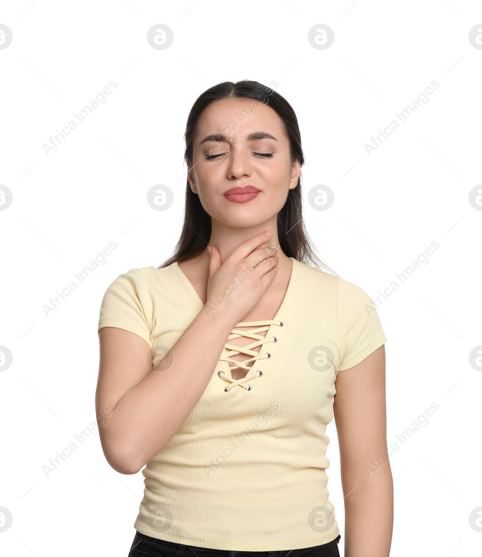 Photo of Young woman suffering from sore throat on white background. Cold symptoms