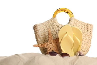 Photo of Bag and different beach objects on sand against white background