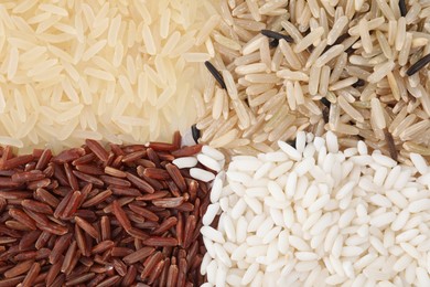 Different sorts of rice as background, top view