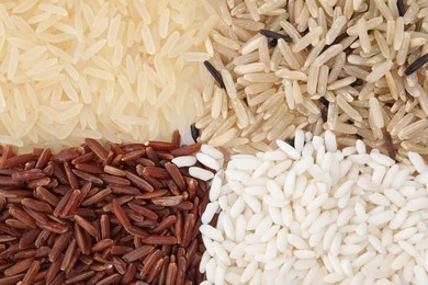 Photo of Different sorts of rice as background, top view