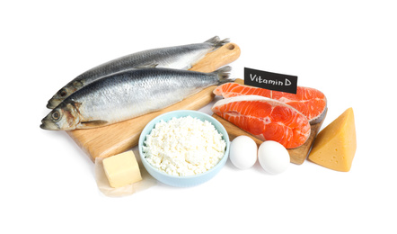 Photo of Fresh products rich in vitamin D on white background