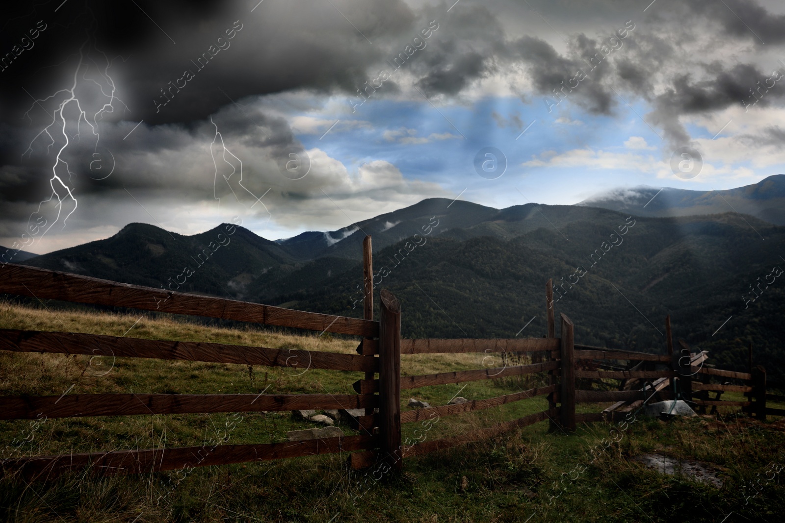 Image of Thunder cloud with lightnings over mountains. Severe weather