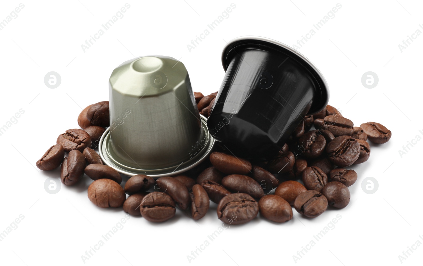 Photo of Coffee capsules and beans isolated on white