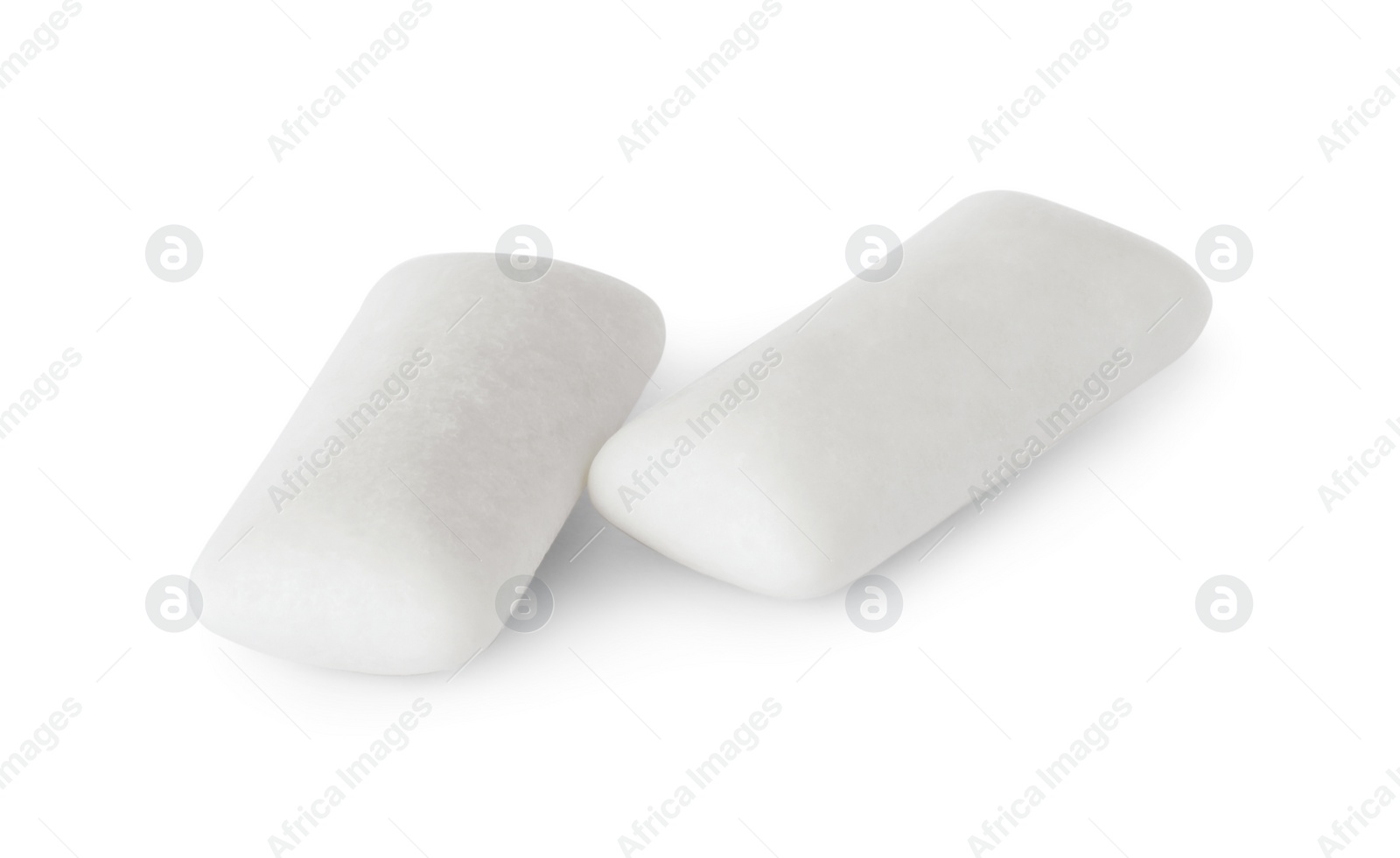 Photo of Two tasty chewing gums on white background