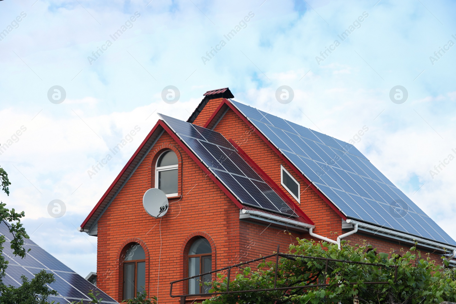 Photo of House with installed solar panels on roof