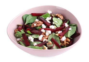 Delicious beet salad with feta cheese and walnuts in bowl isolated on white