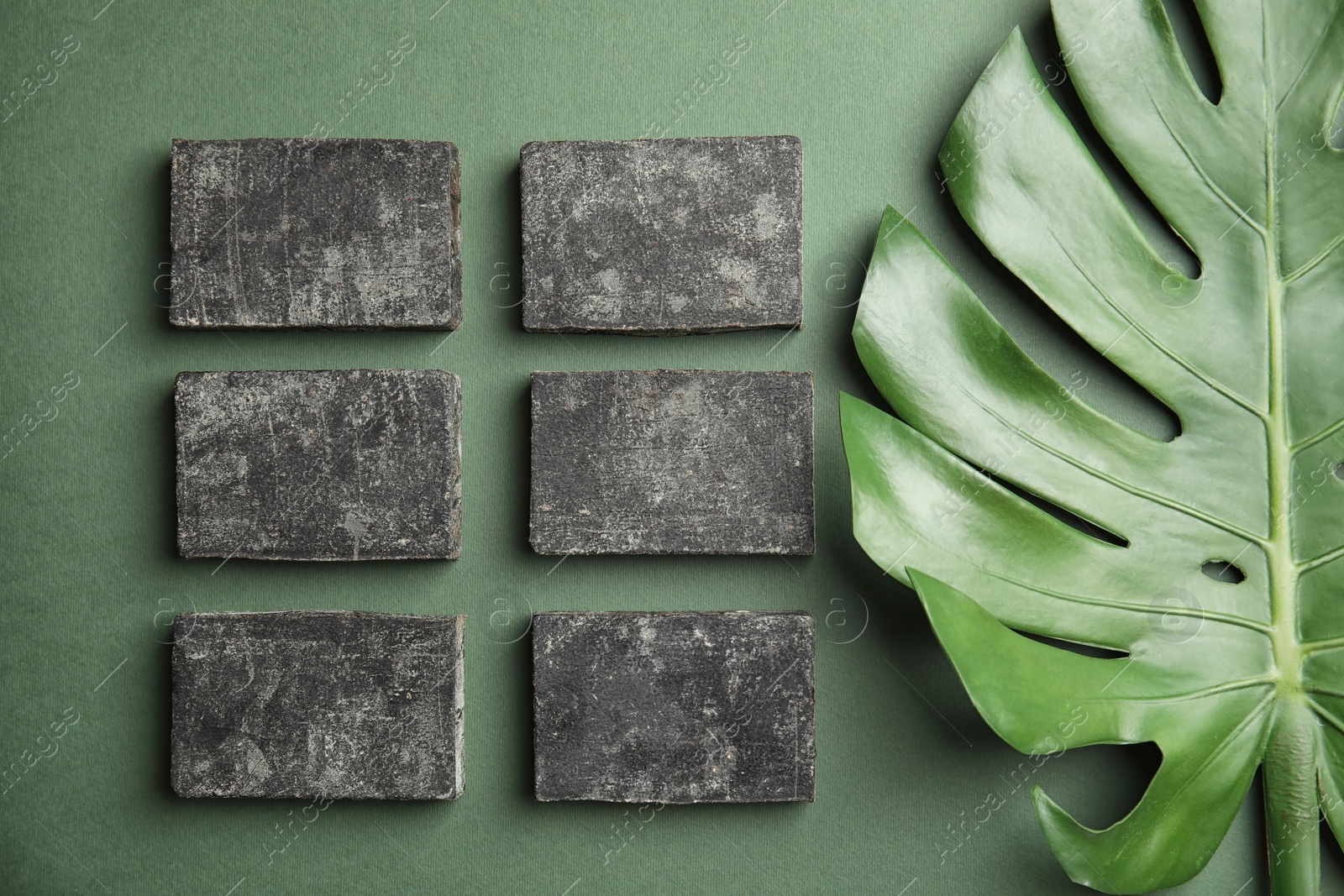 Photo of Flat lay composition with handmade soap bars on color background