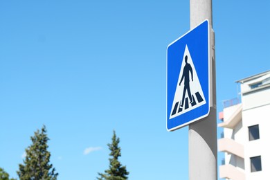 Pedestrian Crossing road sign on city street. Space for text