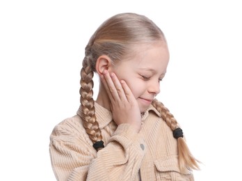 Photo of Cute little girl suffering from ear pain on white background