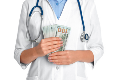 Doctor with bribe on white background, closeup. Corruption in medicine