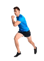 Sporty young man running on white background