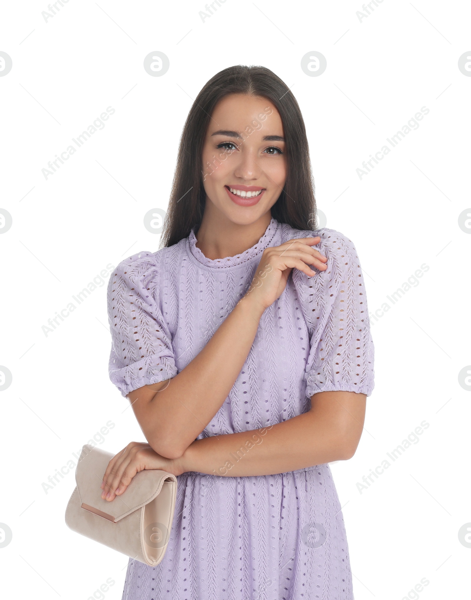 Photo of Young woman wearing stylish lilac dress with elegant clutch on white background