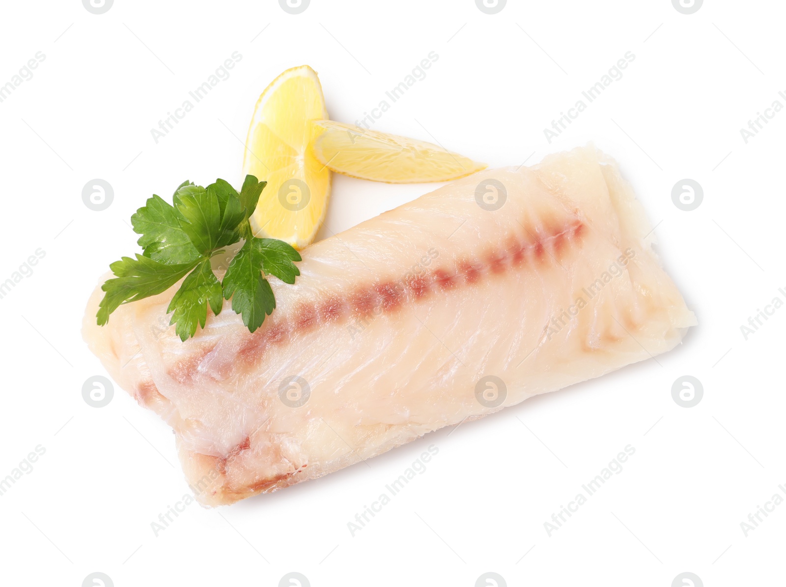 Photo of Pieces of raw cod fish, parsley and lemon isolated on white, top view