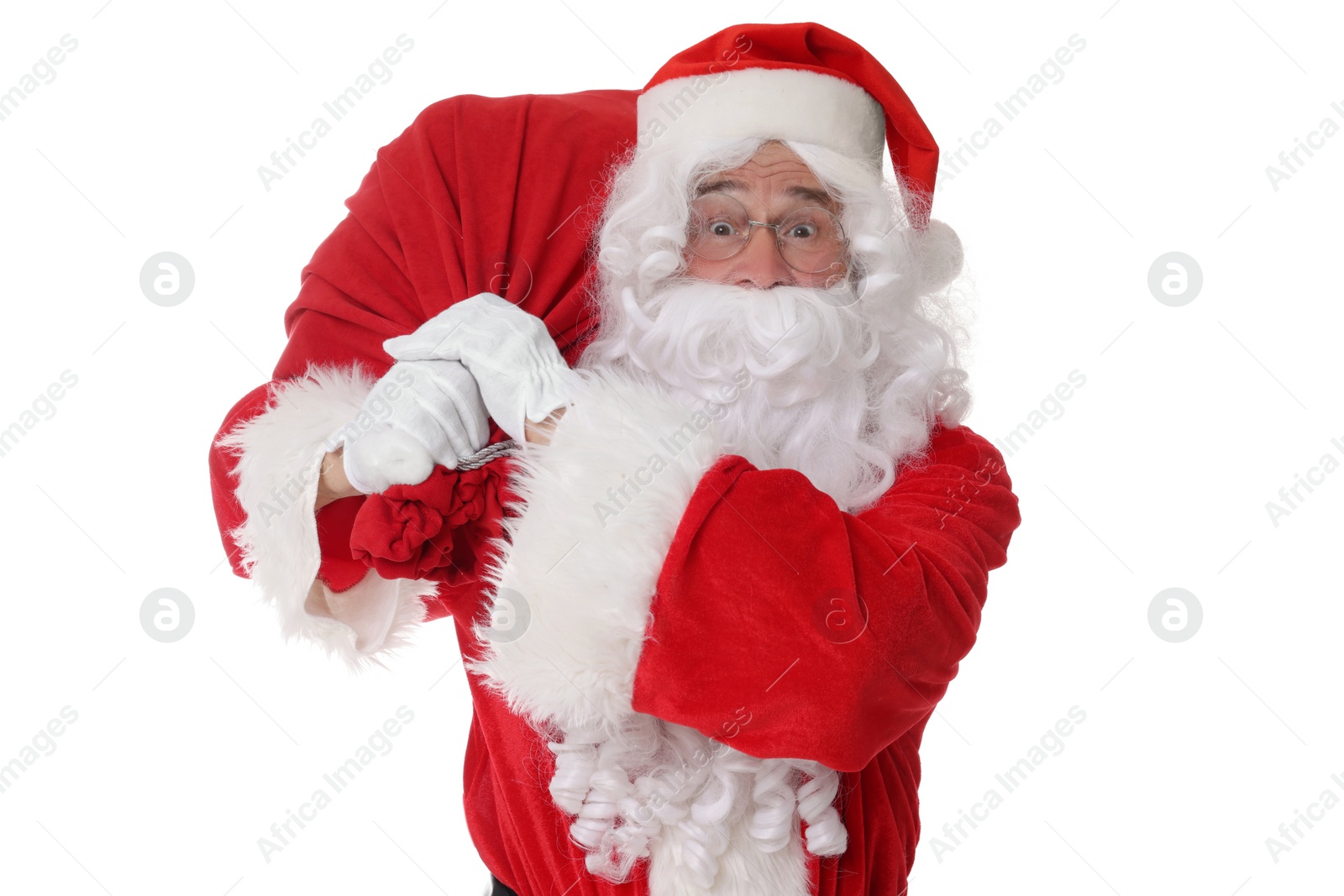 Photo of Man in Santa Claus costume with bag posing on white background