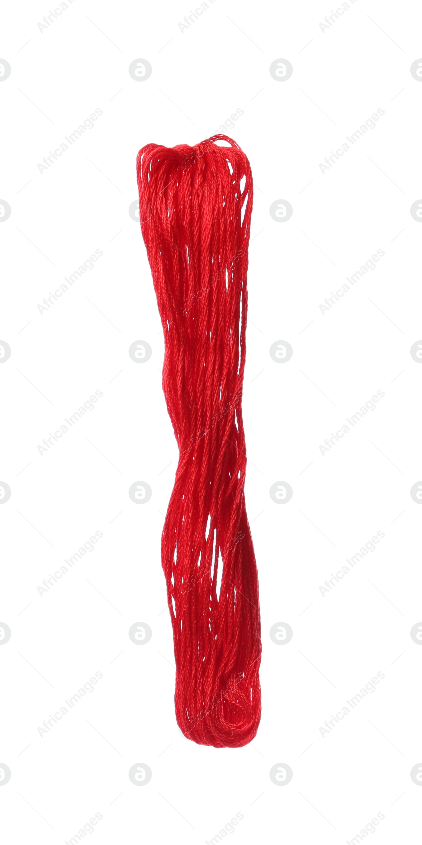 Photo of Bright red embroidery thread on white background