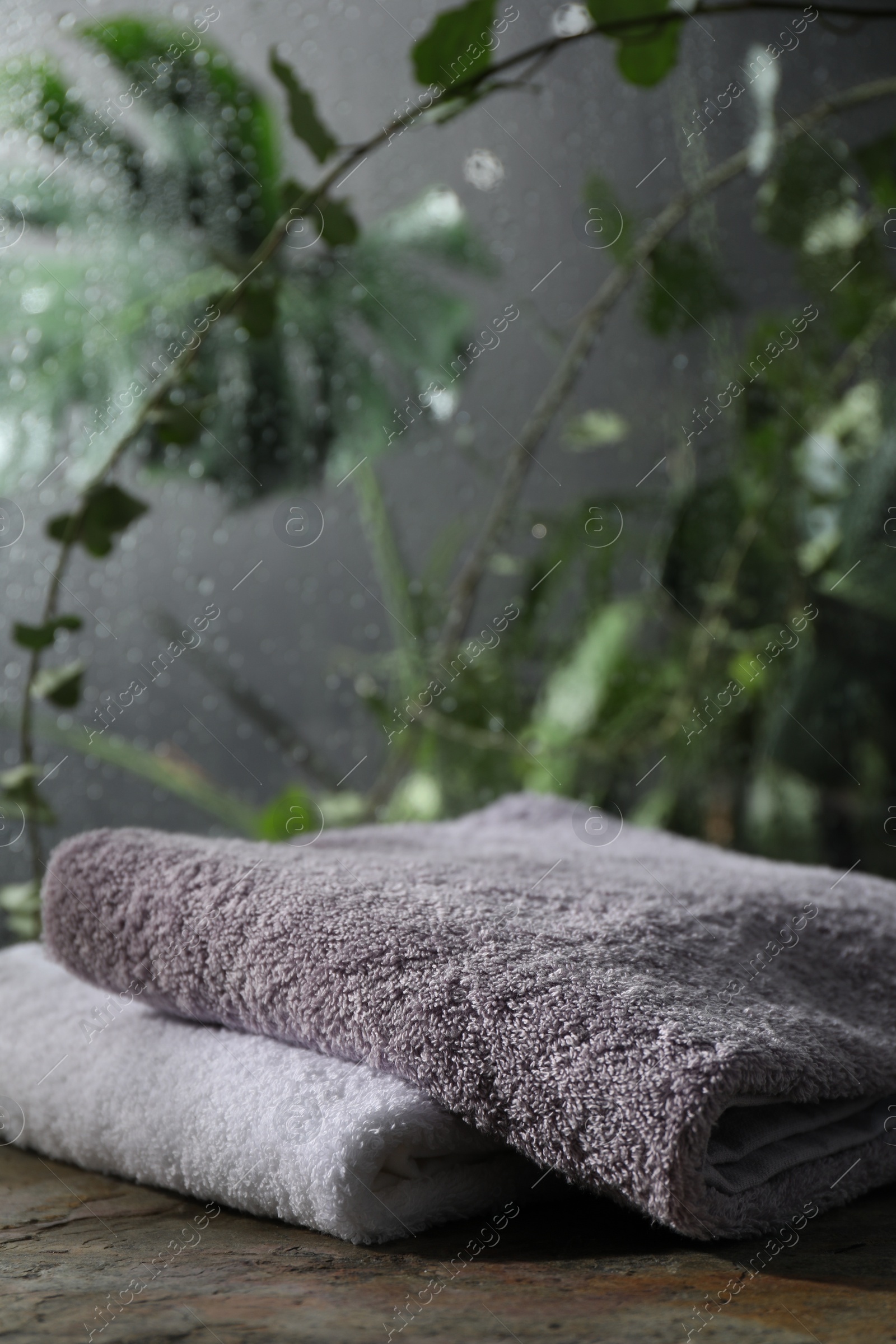 Photo of Two terry towels on table in bathroom