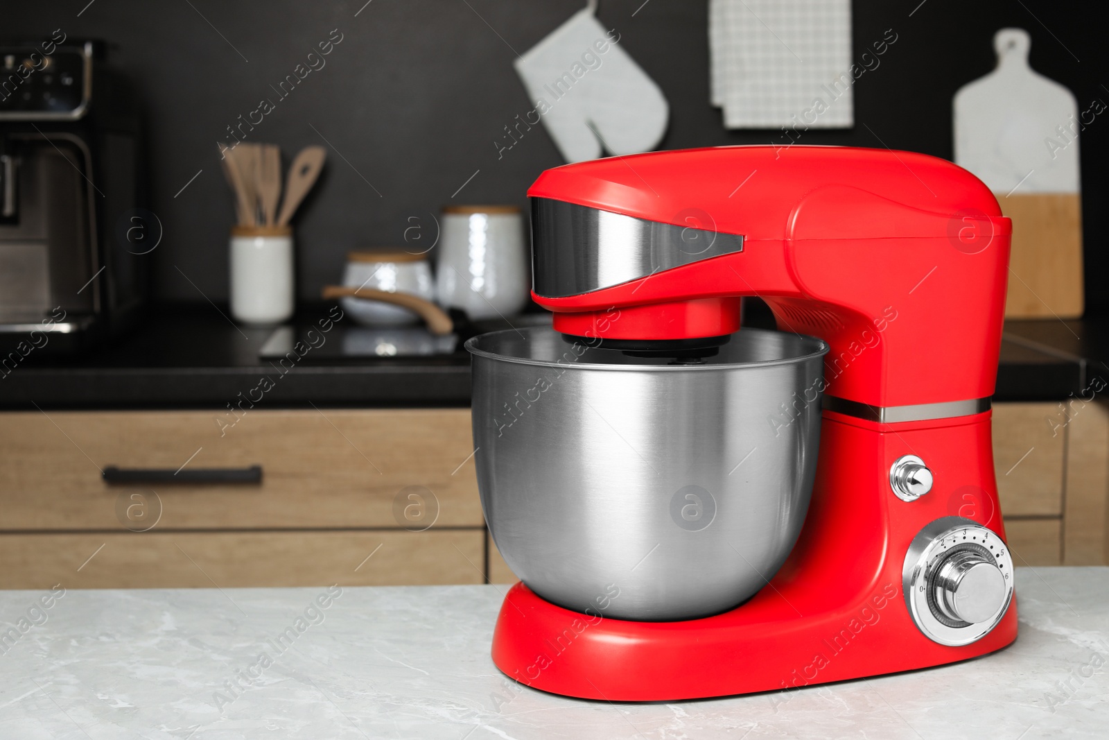 Photo of Modern stand mixer on table in kitchen, space for text. Home appliance