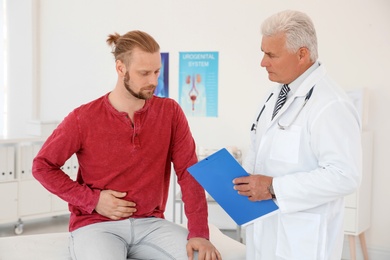 Man with health problems visiting urologist at hospital