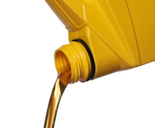 Pouring motor oil from yellow container on white background, closeup