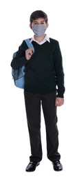 Photo of Boy wearing protective mask and backpack on white background. Child safety