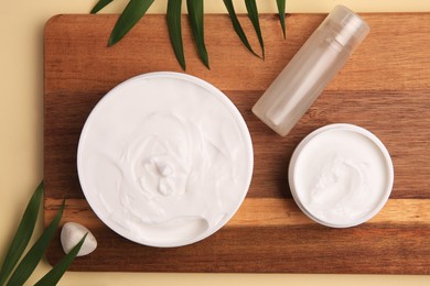 Photo of Flat lay composition with different cosmetic products on beige background