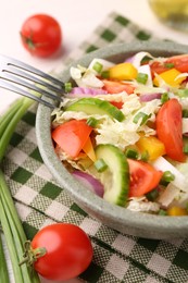 Photo of Tasty salad with Chinese cabbage in bowl on table, closeup