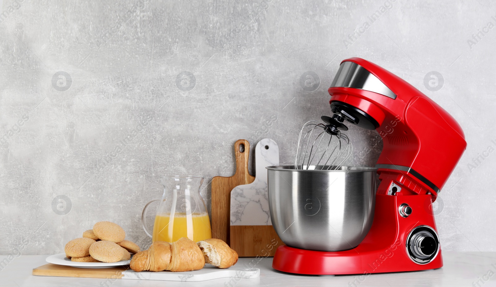 Photo of Composition with modern red stand mixer and different products on white table