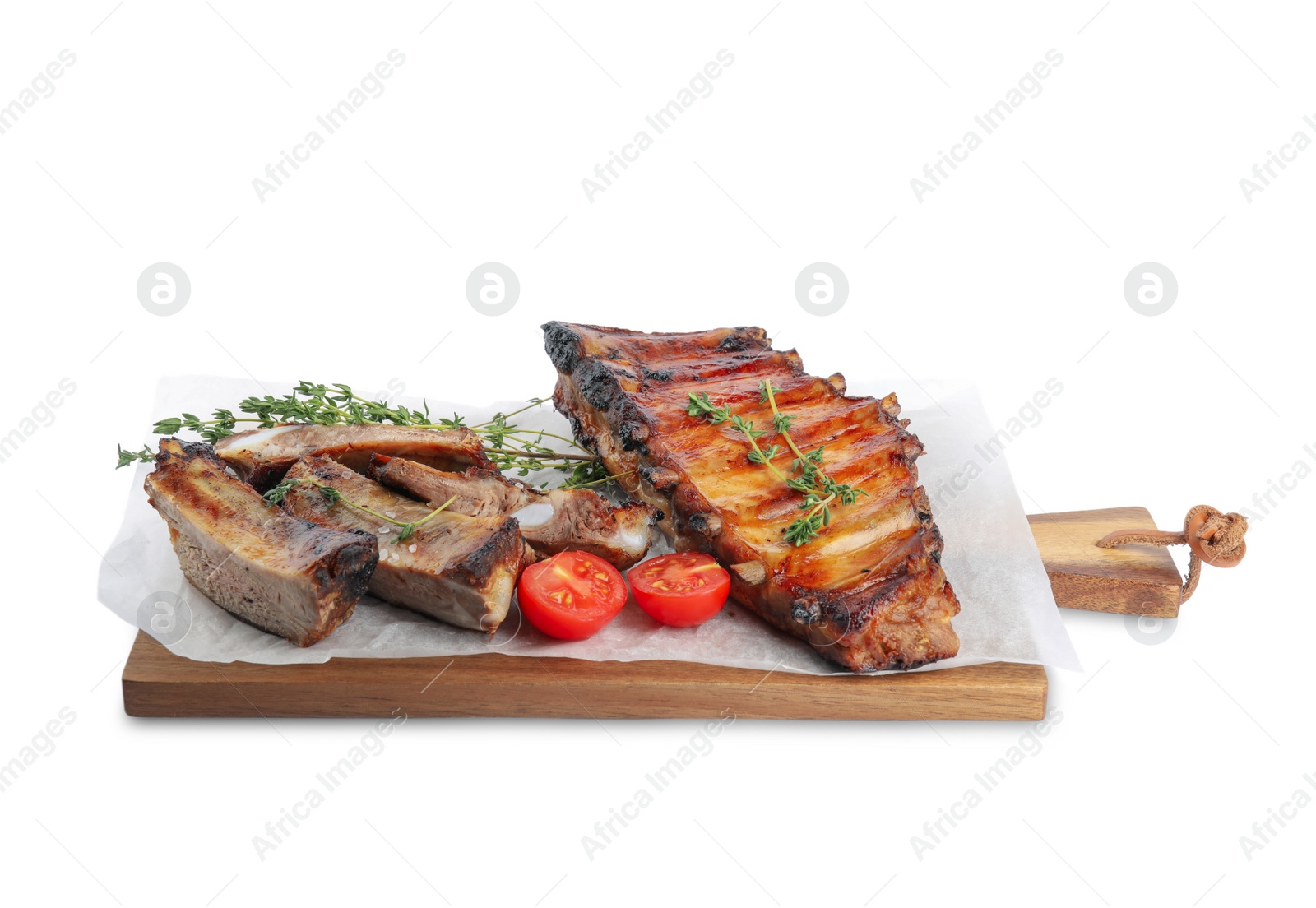 Photo of Tasty grilled ribs with thyme and tomatoes isolated on white