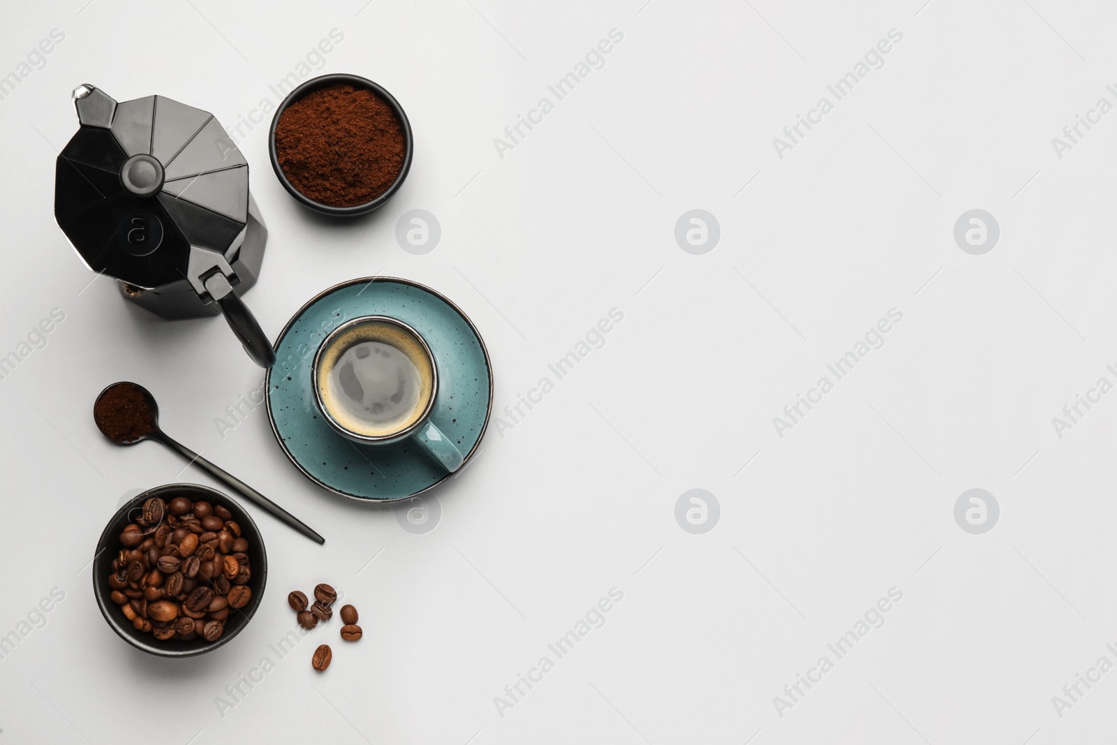 Photo of Flat lay composition with coffee grounds and roasted beans on white background, space for text