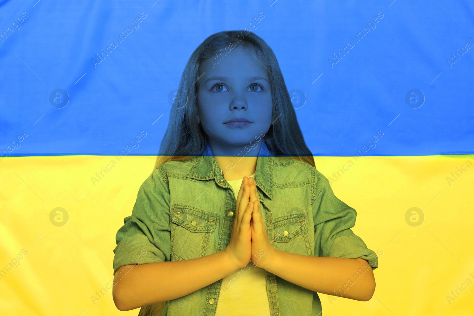 Image of Double exposure of national flag and little girl praying. Stop war in Ukraine