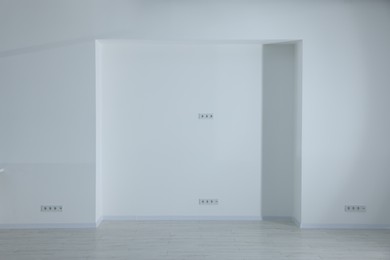 Niche on white wall in empty renovated room