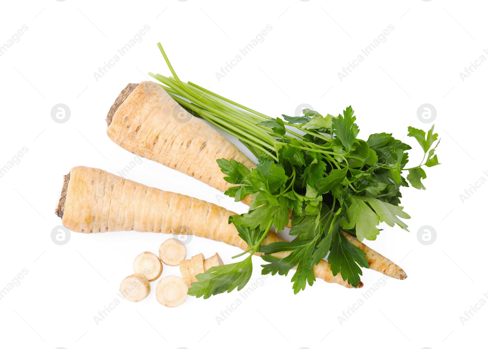 Photo of Raw parsley roots and bunch of fresh herb isolated on white, top view