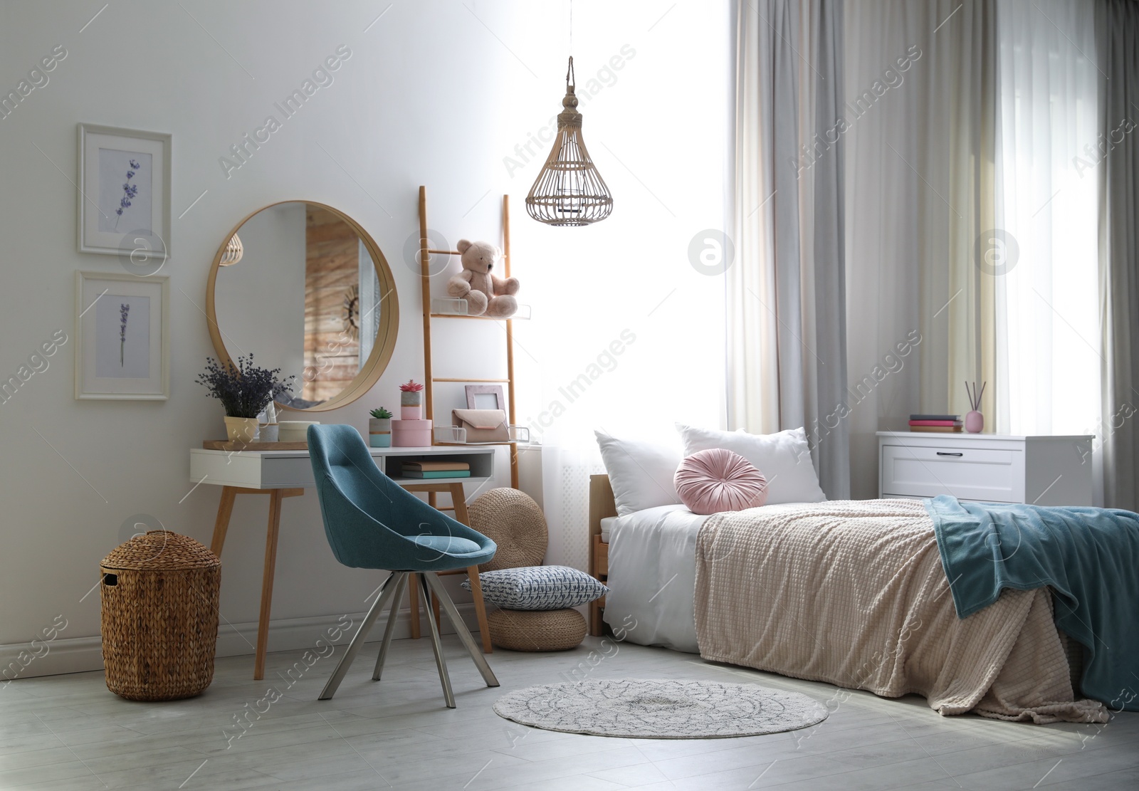 Photo of Teenage girl's bedroom interior with stylish furniture. Idea for design