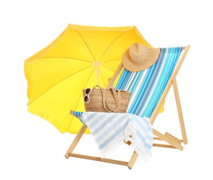 Photo of Open yellow beach umbrella, deck chair and accessories on white background