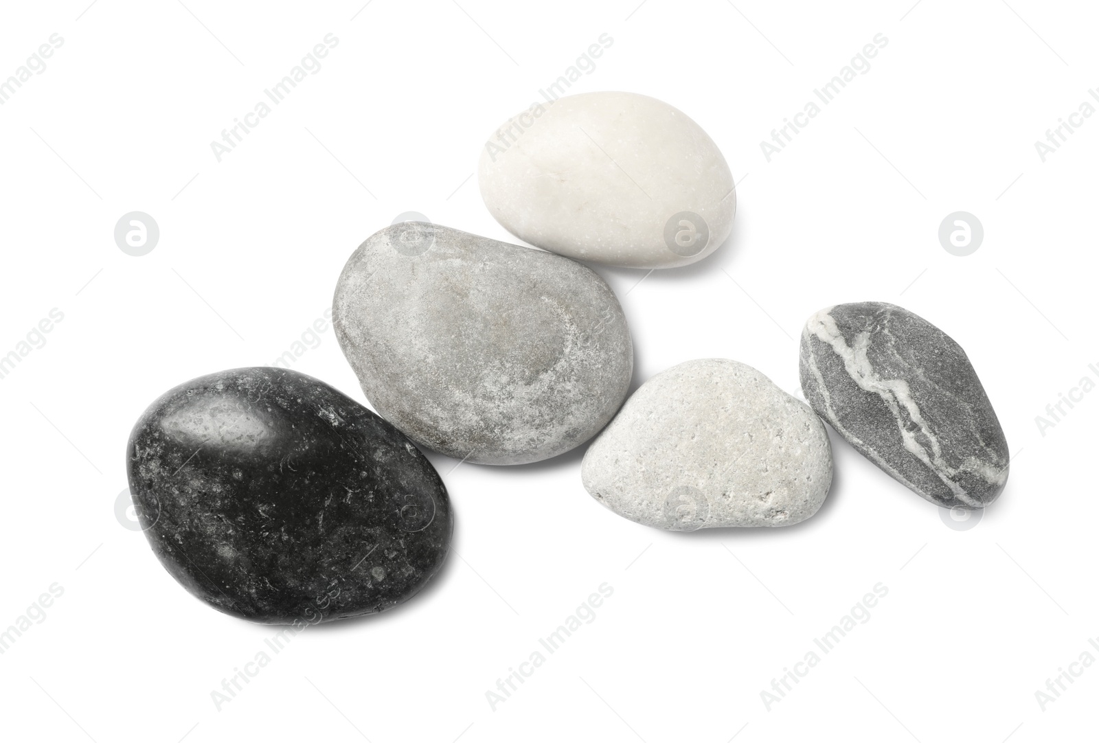 Photo of Group of different stones on white background, top view