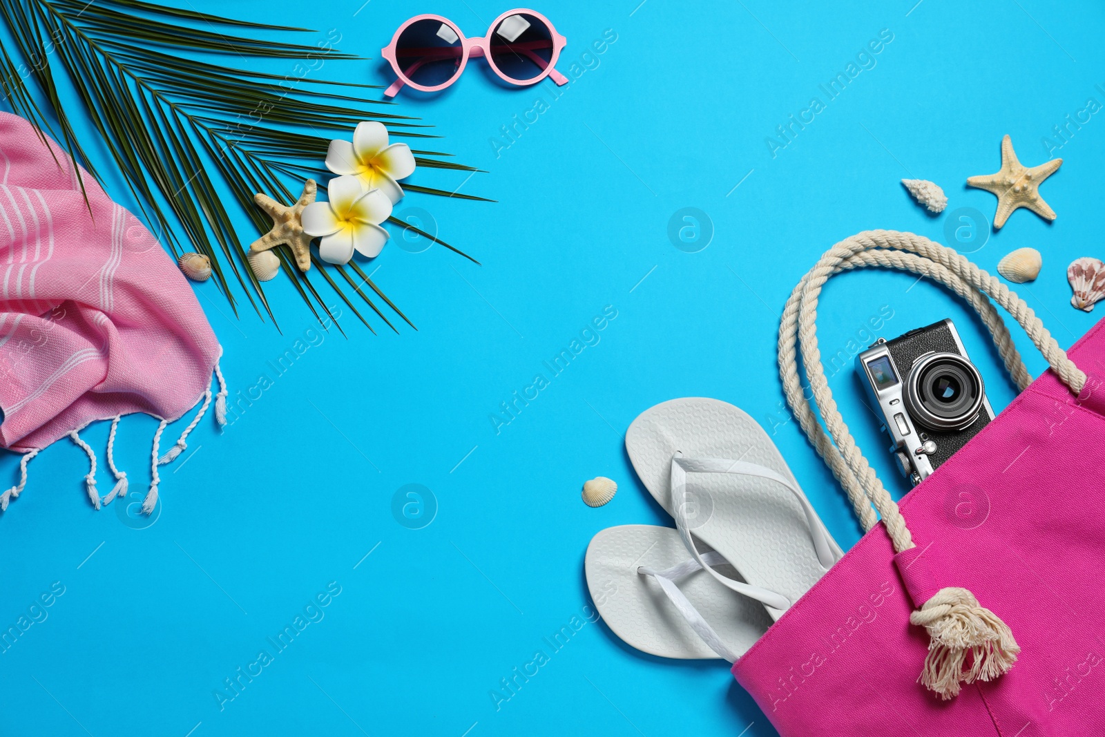 Photo of Flat lay composition with beach accessories on color background, space for text