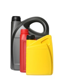Photo of Motor oil in different containers on white background
