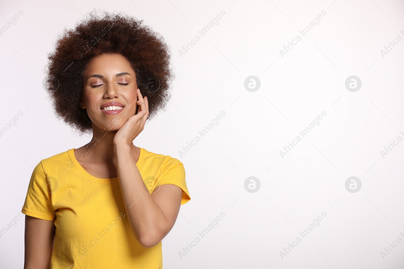 Photo of Portrait of beautiful young woman with glamorous makeup on white background. Space for text