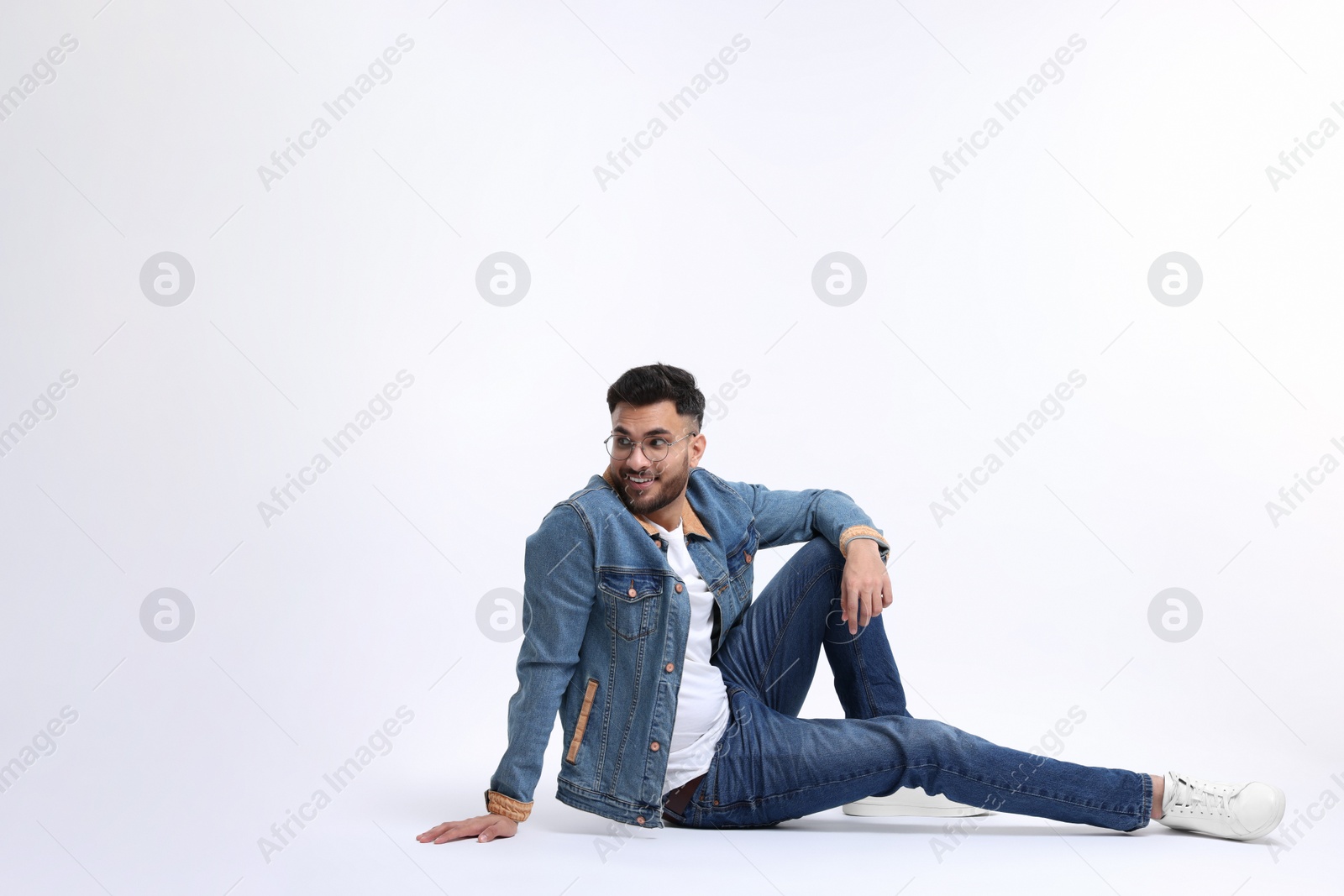 Photo of Handsome young man posing on white background, space for text