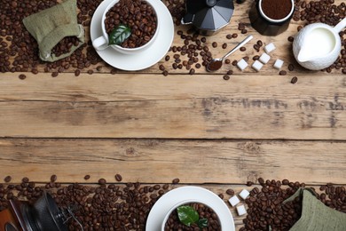 Photo of Flat lay composition with roasted coffee beans on wooden table. Space for text