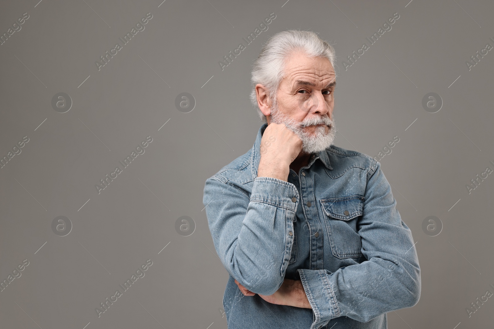 Photo of Senior man with mustache on grey background, space for text