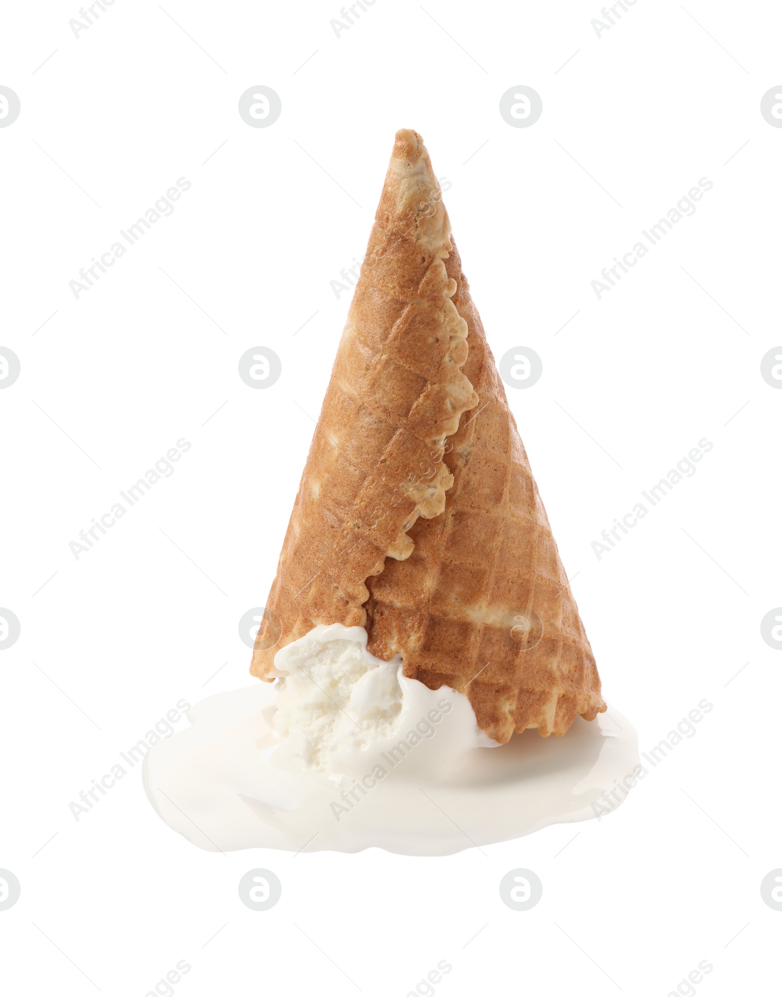 Photo of Melting ice cream in wafer cone isolated on white