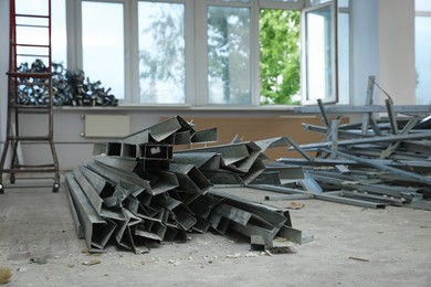 Photo of Used building materials in room prepared for renovation