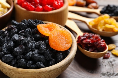 Photo of Composition with different dried fruits on wooden background, closeup. Healthy lifestyle