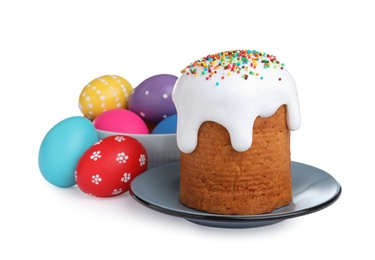 Photo of Traditional Easter cake and colorful eggs on white background