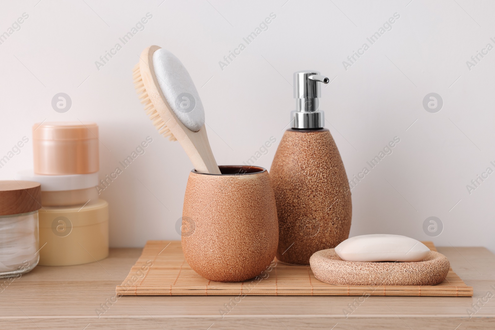 Photo of Different bath accessories and personal care products on wooden table